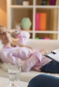 Female lying in couch during hypnotherapy session